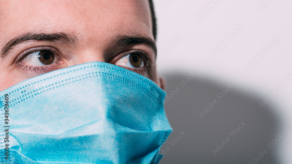 Boy with protective mask for virus and pollution looking at camera. White background with copy space. Boy with protective mask for virus and pollution looking at camera. White background with copy space.