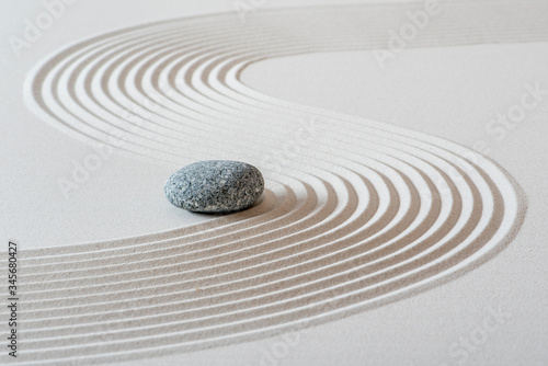 japanese garden with stone in textured sand