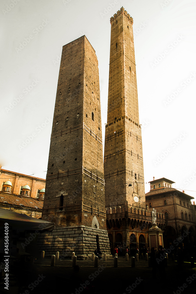 Two of most famous towers in Bologna, Italy: Torre degli Asinelli and the Torre Garisenda. Asinelli tower was built in the 11th century. It is over 97 metres tall, making it the tallest in Italy.