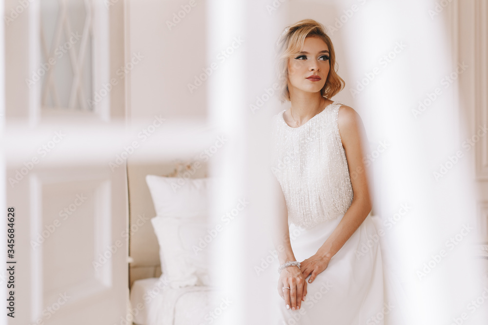 Portrait of the bride. Young girl, blonde with a short haircut. Close-up, vintage. Beautifully poses Portrait of the bride. Young girl, blonde with a short haircut. Close-up, vintage. Beautifully poses