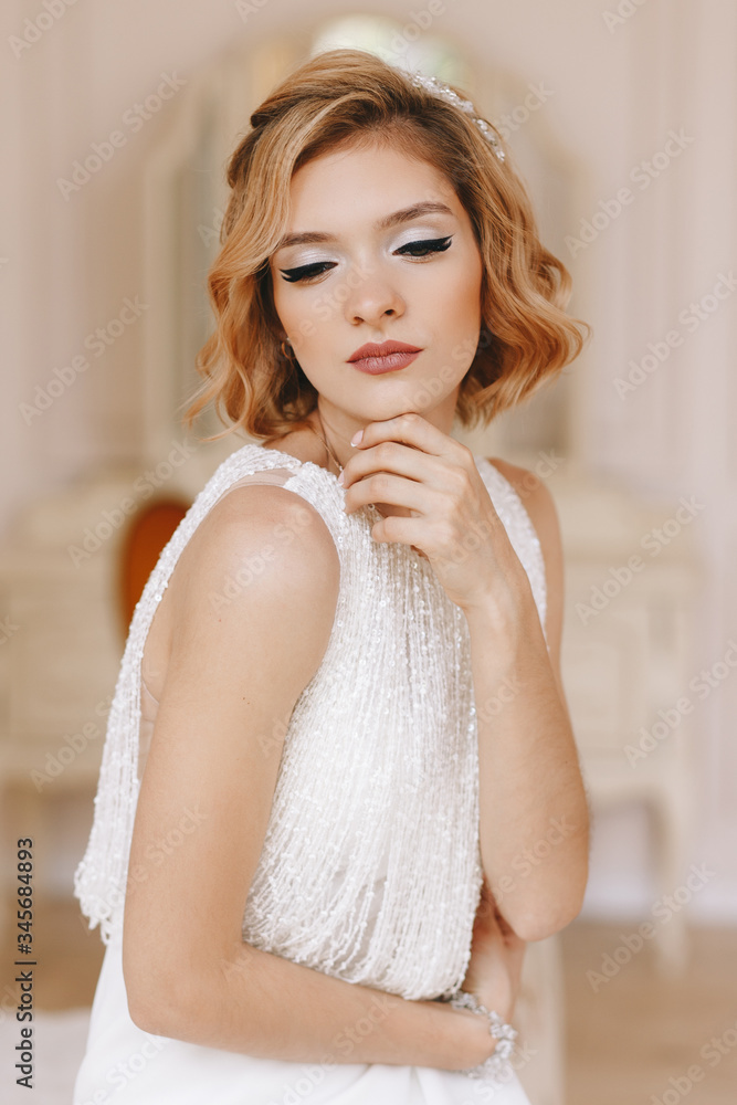 Portrait of the bride. Young girl, blonde with a short haircut. Close-up, vintage. Beautifully poses Portrait of the bride. Young girl, blonde with a short haircut. Close-up, vintage. Beautifully poses