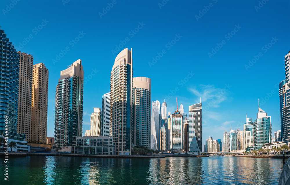 Fototapeta premium Luxury Dubai Marina canal in Dubai with high buildings at background, United Arab Emirates.