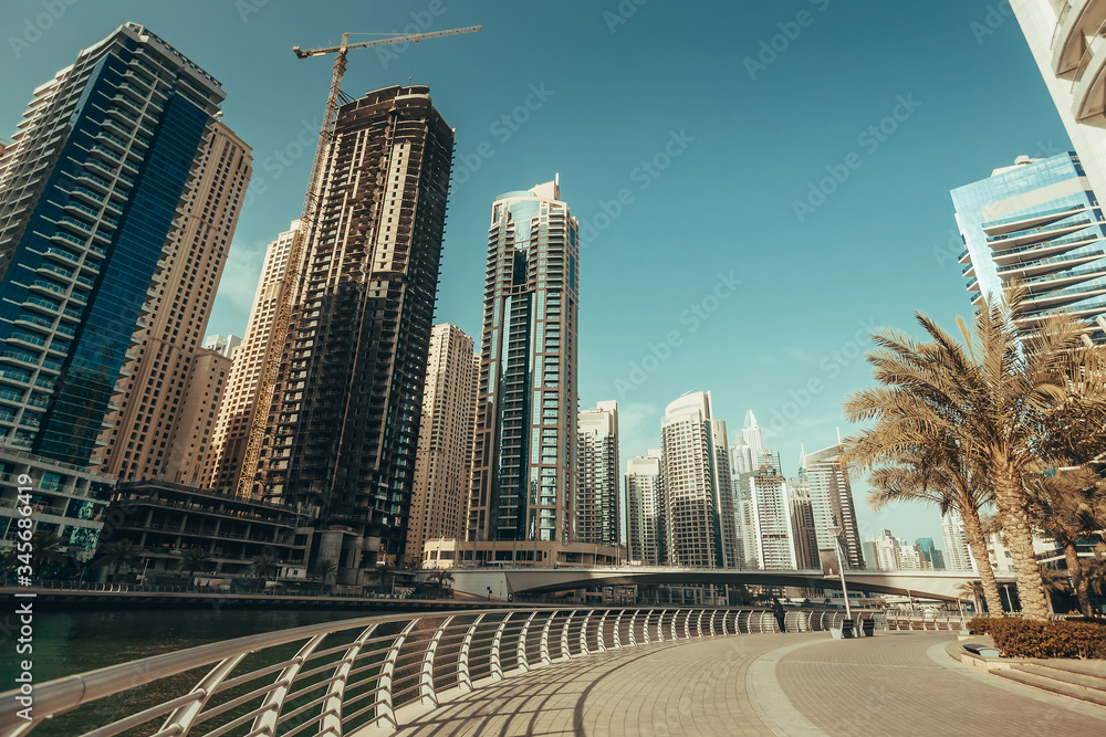Fototapeta premium Dubai Marina promenade in sunny day, United Arab Emirates.