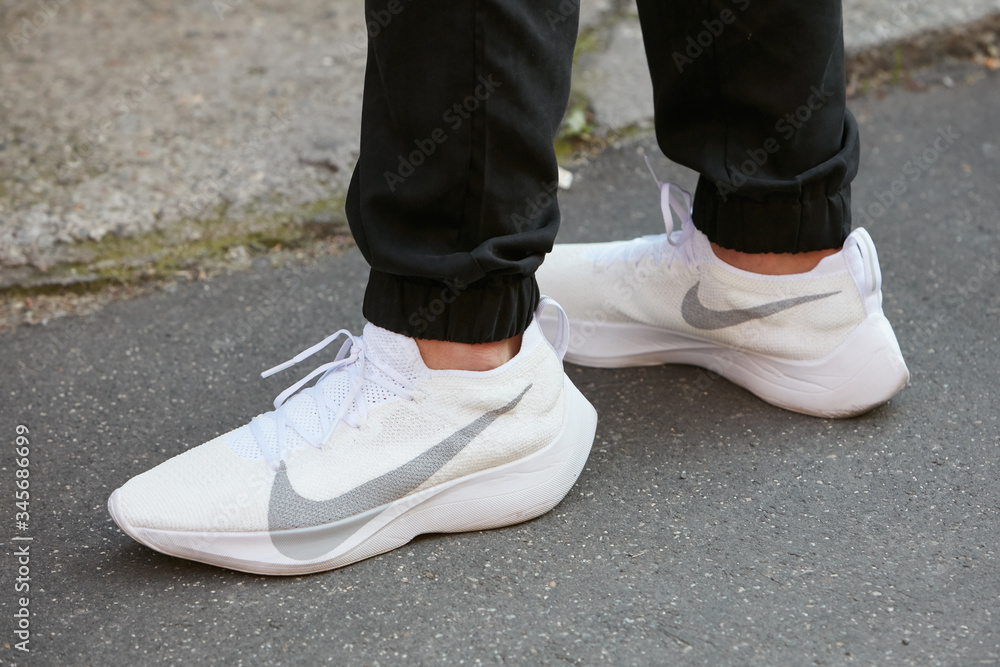 Man with Nike white sneakers on June 17, 2018 in Milan, Italy Stock Photo |  Adobe Stock