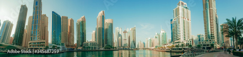 Panorama of Dubai Marina skyline with many skyscrapers, United Arab Emirates.