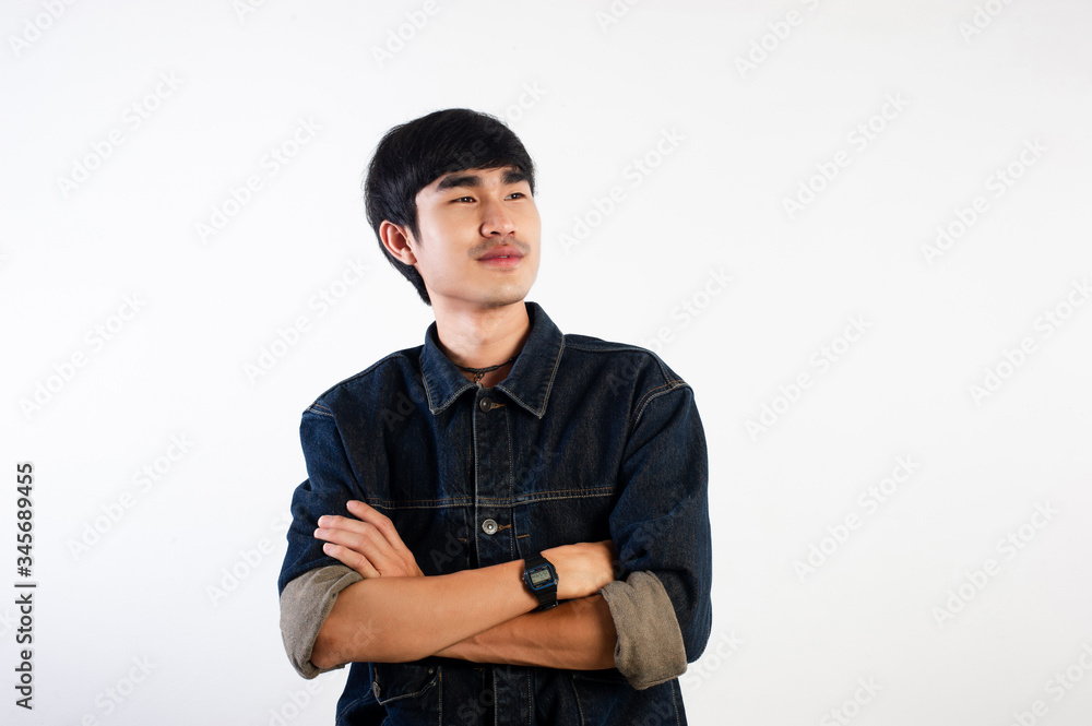 A smiling Thai man is smiling happily for life. For the surroundings Siamese smiles and optimism. The concept of happiness. A smiling Thai man is smiling happily for life. For the surroundings Siamese smiles and optimism. The concept of happiness.