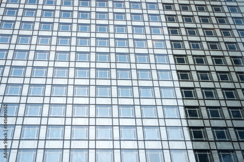geometry glass background. High-rise housing. Modern building steel walls and glass windows. Building construction. City designing and building. Architecture and structure. business rent building geometry glass background. High-rise housing. Modern building steel walls and glass windows. Building construction. City designing and building. Architecture and structure. business rent building