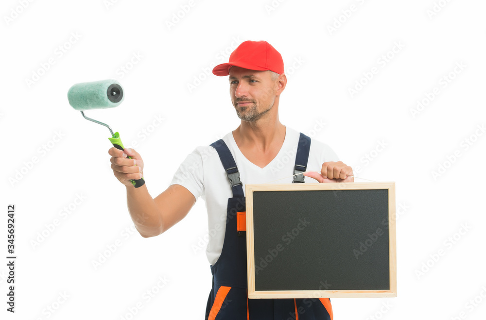 Useful tips. Chalkboard copy space. Paint rolling. Decorator hold paint roller. Renewal and redecorating. Professional equipment. Mature man in cap. Wall painter. Paint shop. Renovation and repair Useful tips. Chalkboard copy space. Paint rolling. Decorator hold paint roller. Renewal and redecorating. Professional equipment. Mature man in cap. Wall painter. Paint shop. Renovation and repair