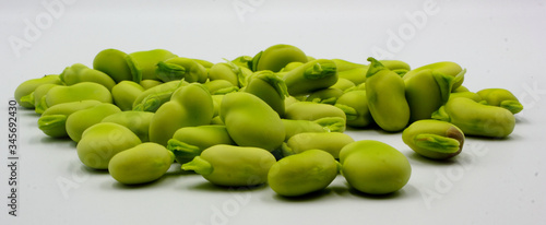 panoramic pile of fresh shelled broad beans isolated on a white background photo