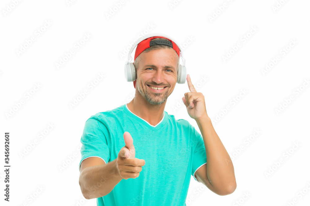 Join along. Happy man pointing straight isolated on white. Handsome guy listen to music pointing gesture. Index finger pointing. Pointing for advertising. Promotion and advertisement