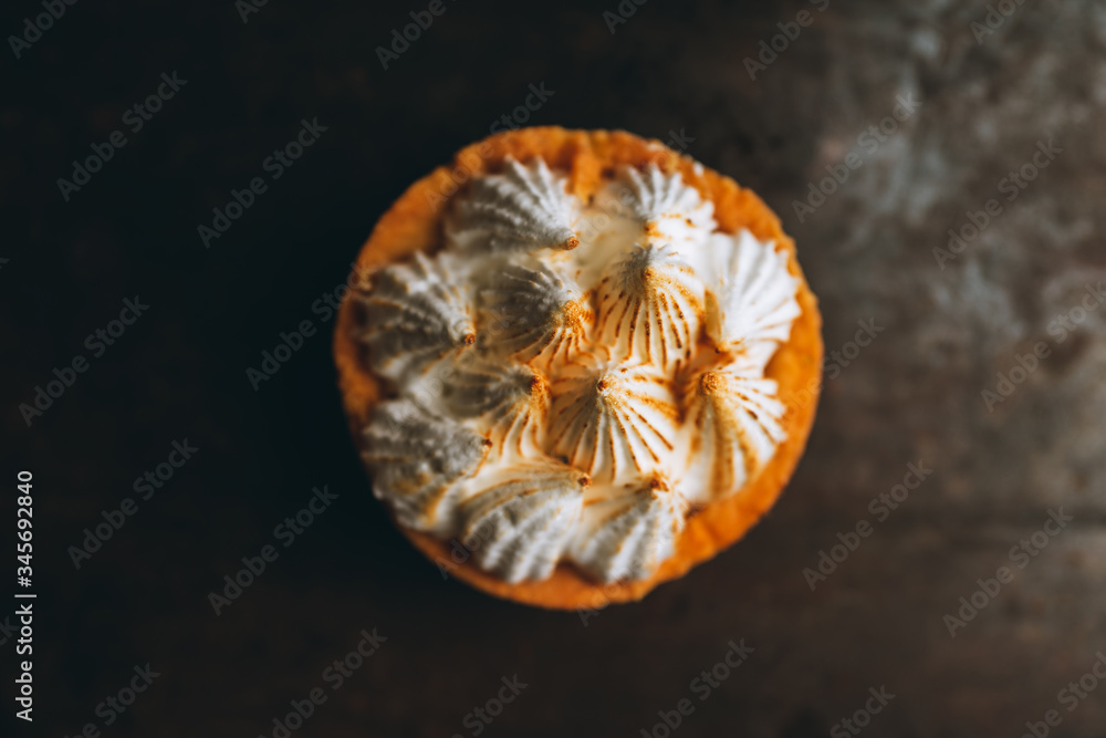Creamy cake decorated with meringue cream on the rustic background. Selective focus. Shallow depth of field.
Creamy cake decorated with meringue cream on the rustic background. Selective focus. Shallow depth of field.