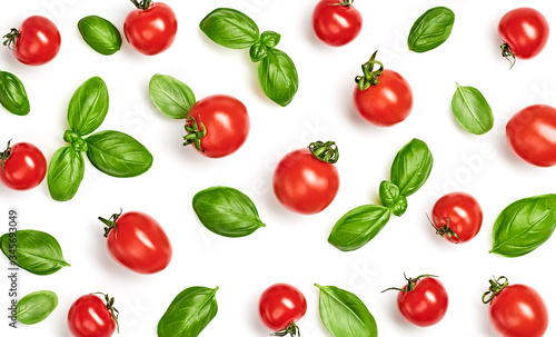 Tomato, basil pattern. Vegan diet food, creative cherry tomato background isolated on white. Fresh basil, vegetable tomatoes layout, cooking concept, fashion wallpaper