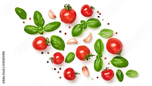 Tomato, basil pattern. Vegan diet food, creative cherry tomato border isolated on white. Fresh basil, vegetable tomatoes layout, cooking concept, fashion wallpaper