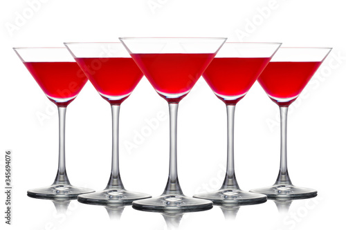Set of strawberry margarita cocktail in martini glasses isolated on white