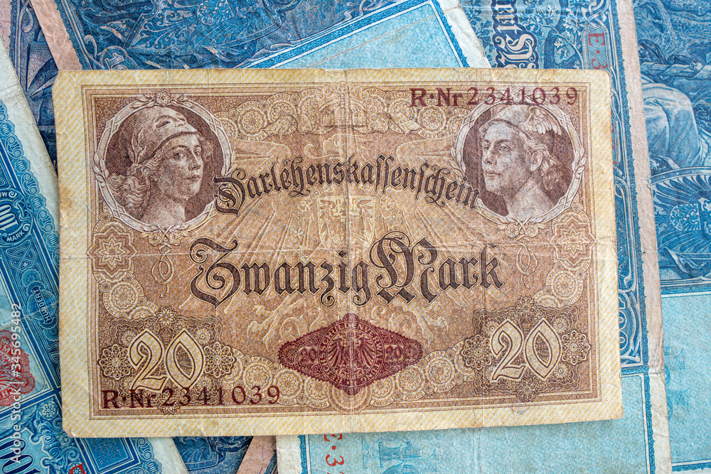 some old historical German banknotes lie spread out on a table