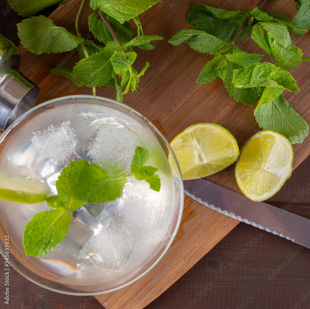 Preparation of fruit drink with lemon and mint. Top view - obrazy, fototapety, plakaty 