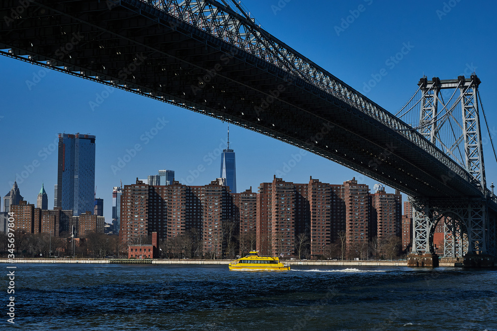 Yellow- Boat- Williamsburg- Bridge- One World Trade Center- East River- New York City- Manhattan- United States- USA.