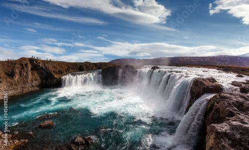 Big waterfall with perfect sky in sunny day. Wonderful nature of Iceland. Godafoss is a very beautiful Icelandic waterfall. Popular Locations for traveler and photografers