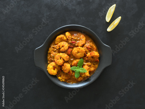 Hot spicy prawn curry. Shrimp in curry sauce in the pan photo