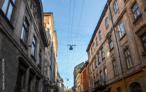 Bottom view between the buildings and houses narrow streets historic center of the Lviv city  Ukraine. Streets and architecture of the old town