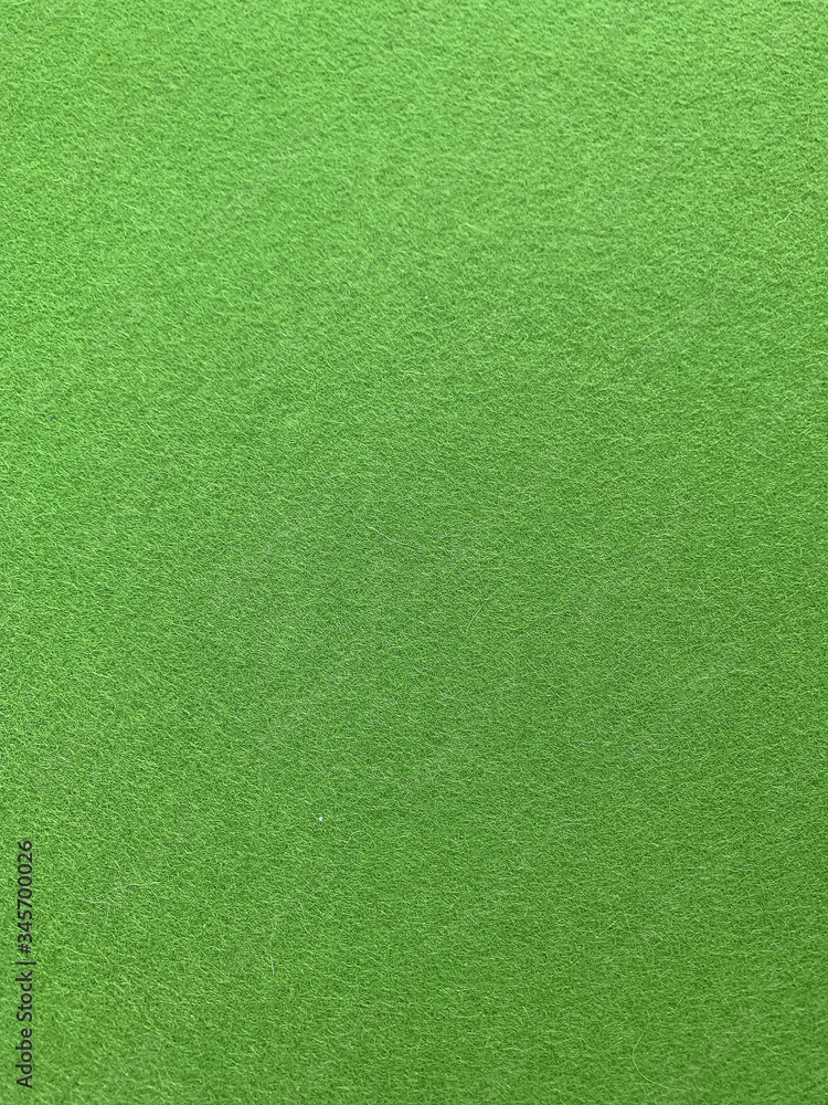Close up view of green felt fabric background. Close up view of green felt fabric background.