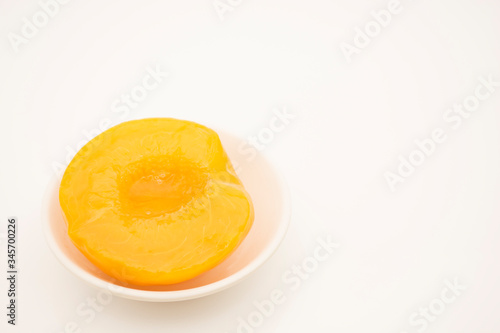 Peaches in syrup and cut in halves.
