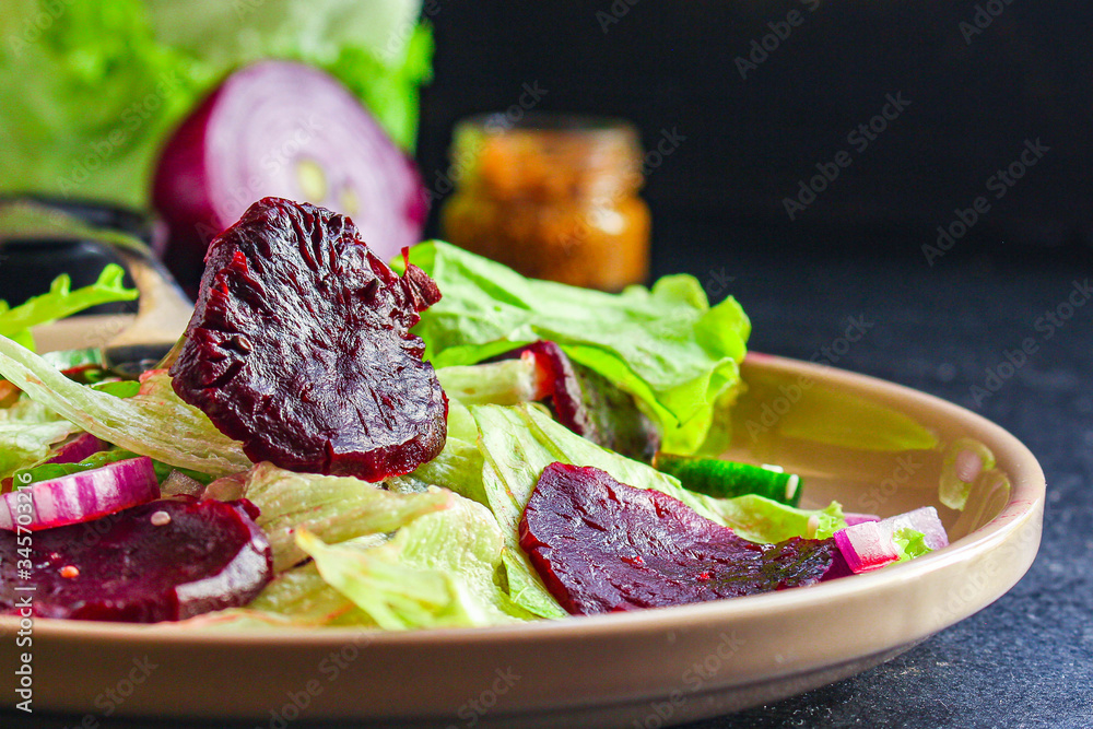 healthy salad beetroot slices, iceberg lettuce, greens. Menu concept food background, keto or paleo diet. top view. copy space for text