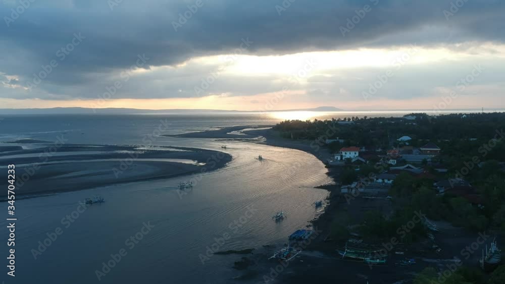 drone dolly over the sea where boats sail for sunset and many clouds Prancak Perancak Peninsula drone dolly over the sea where boats sail for sunset and many clouds Prancak Perancak Peninsula
