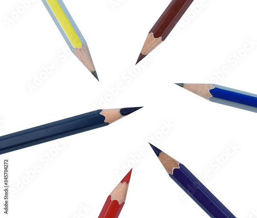 Six different color wood pencil crayons scattered across a white background