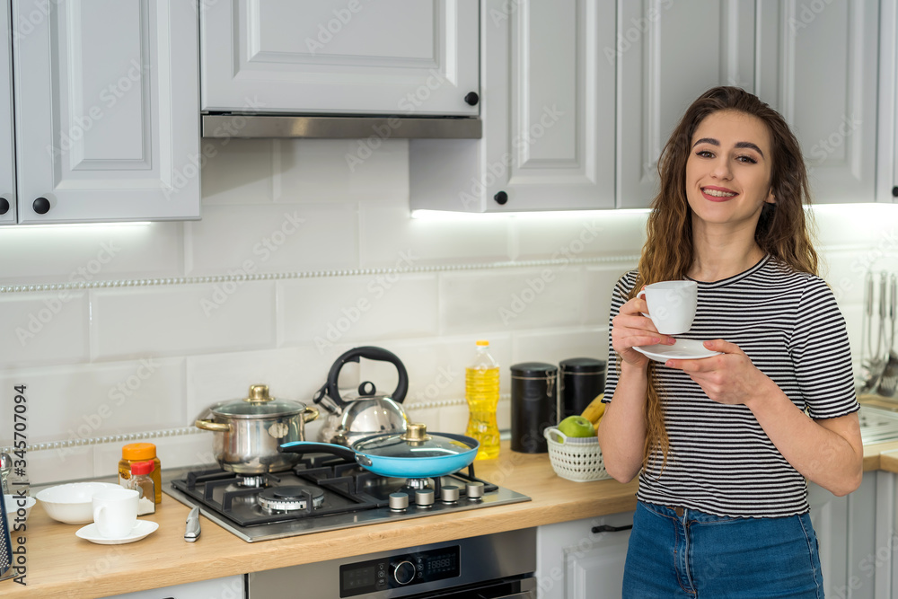 Gorgeous woman relax morning in kitchen and drinking enjoy coffee Gorgeous woman relax morning in kitchen and drinking enjoy coffee