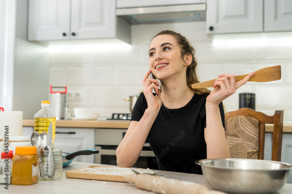Pretty woman  kneading dough at home, cooking food for healthy lifestyle