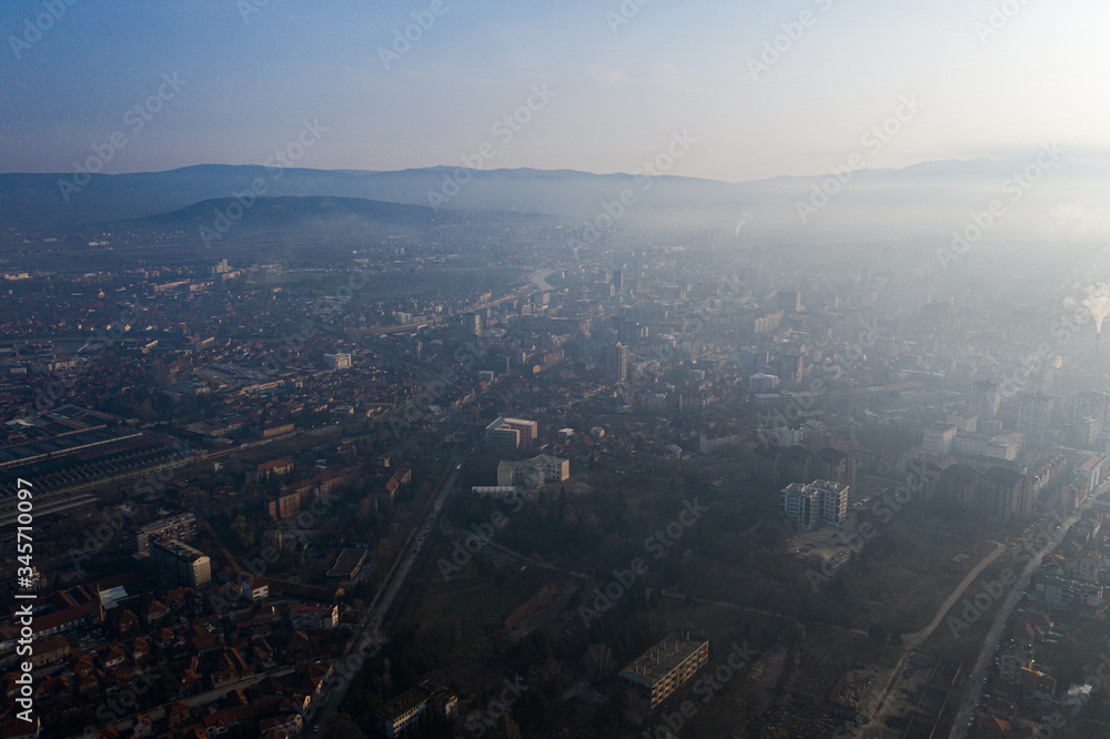 Drone photo of the city of Nis at foggy morning, Serbia cityscape
