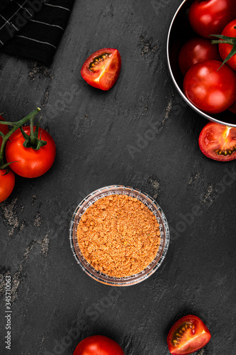 Tomato Powder (close up; selective focus) on vintage background photo