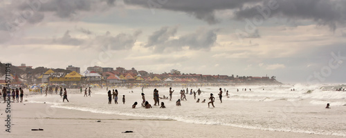Pessoas na praia tomando banho de mar em Salinópolis, Pará. photo