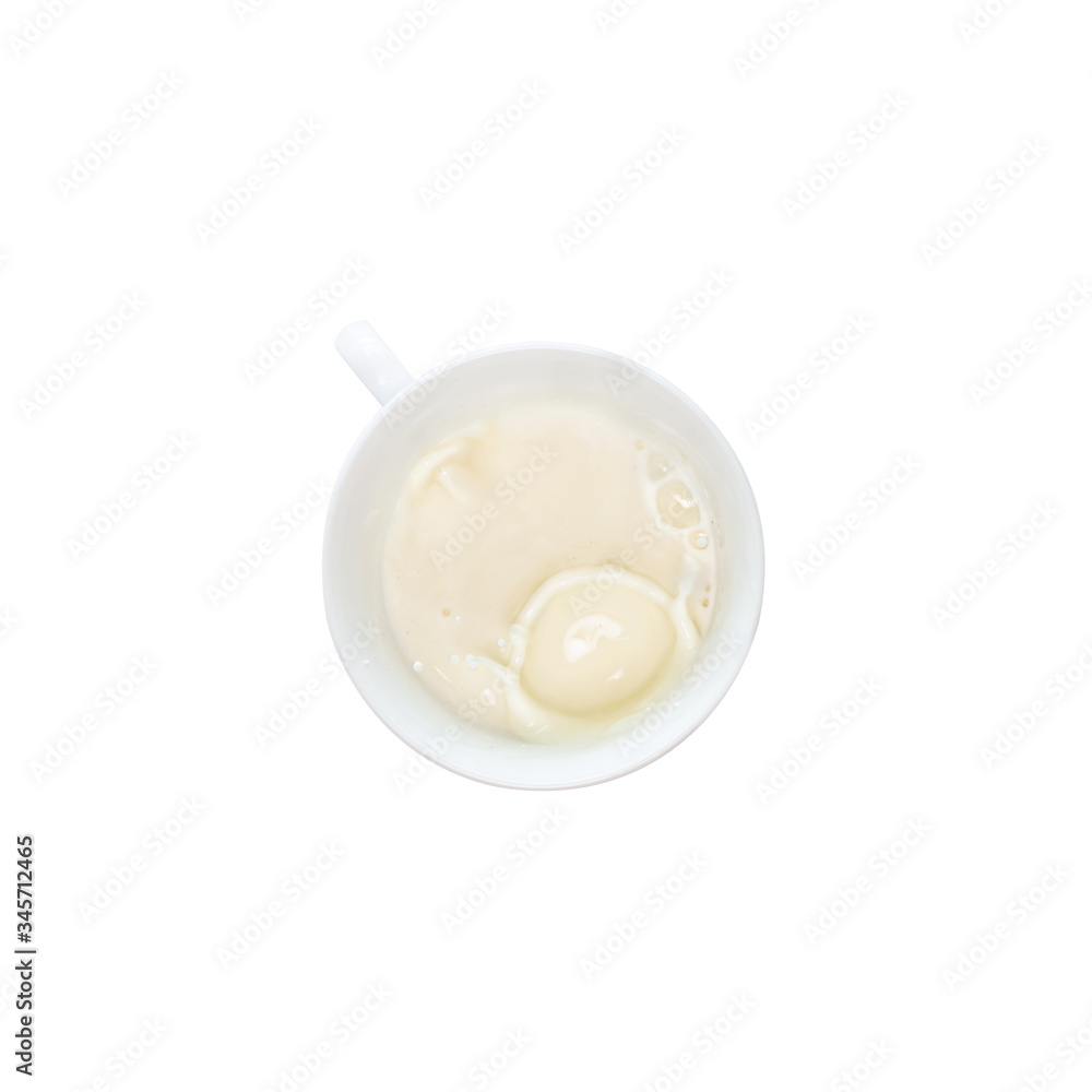 Milk splash from a cup isolated on white background, top view Milk splash from a cup isolated on white background, top view