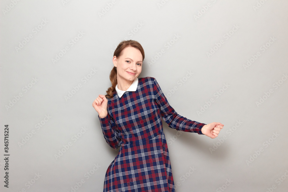 Portrait of happy carefree joyful girl dancing and smiling Portrait of happy carefree joyful girl dancing and smiling