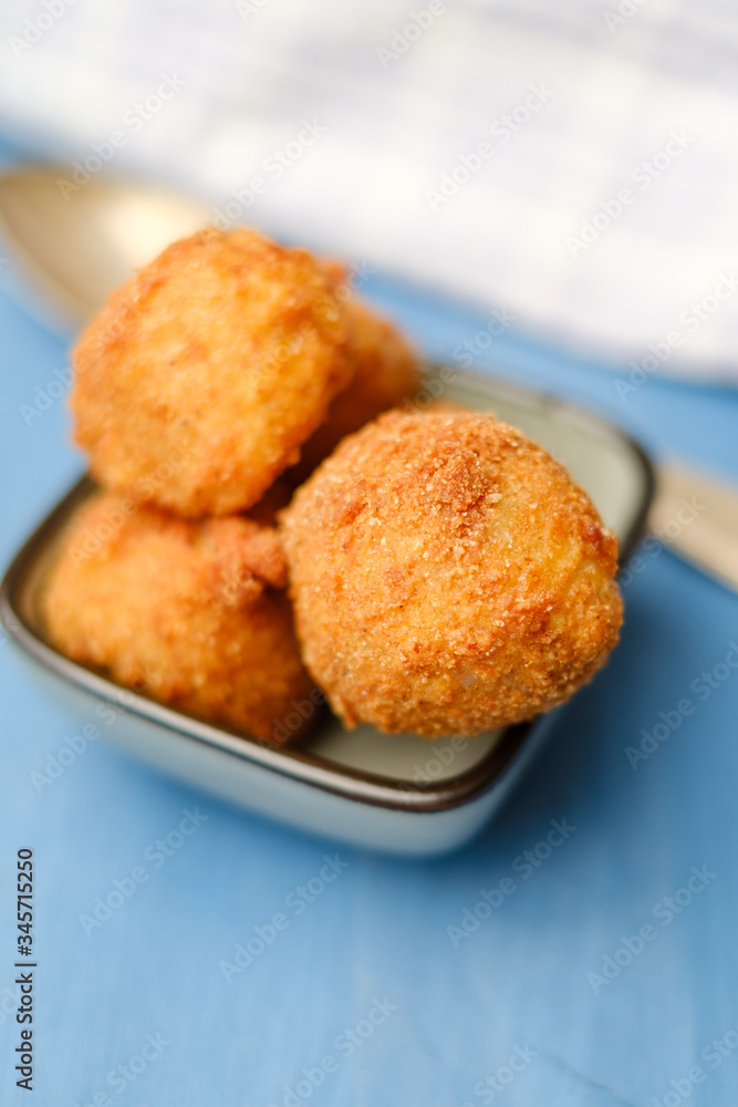 Arancini fried risotto balls in a bowl ready to be eaten