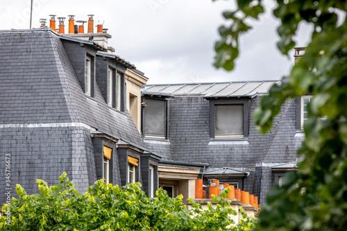 Paris, France - May 1, 2020: Typical roofs of haussmann buildings in Paris photo