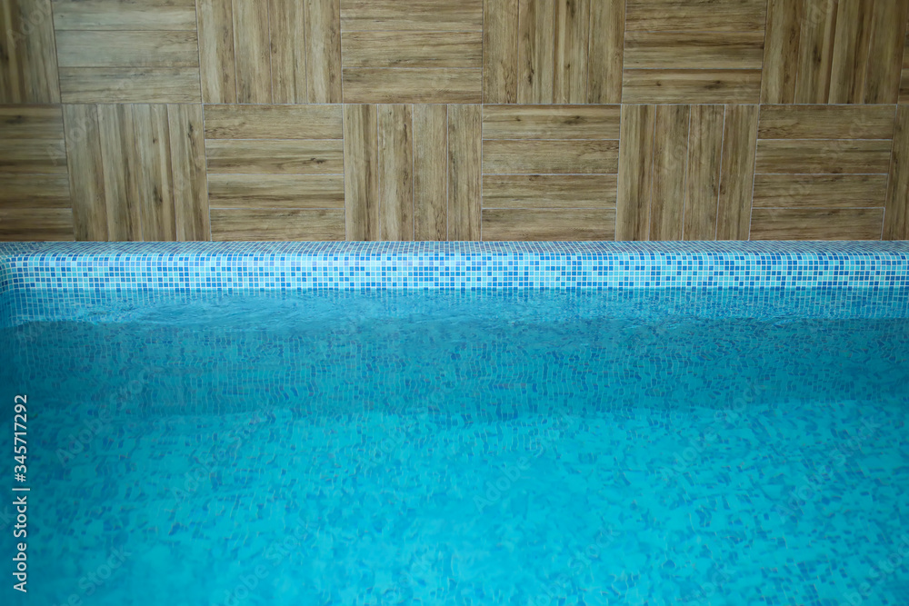 Swimming pools and walls made of wood, decorated for the pool in a sauna