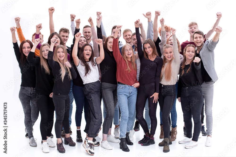 group of confident young people standing with their hands up