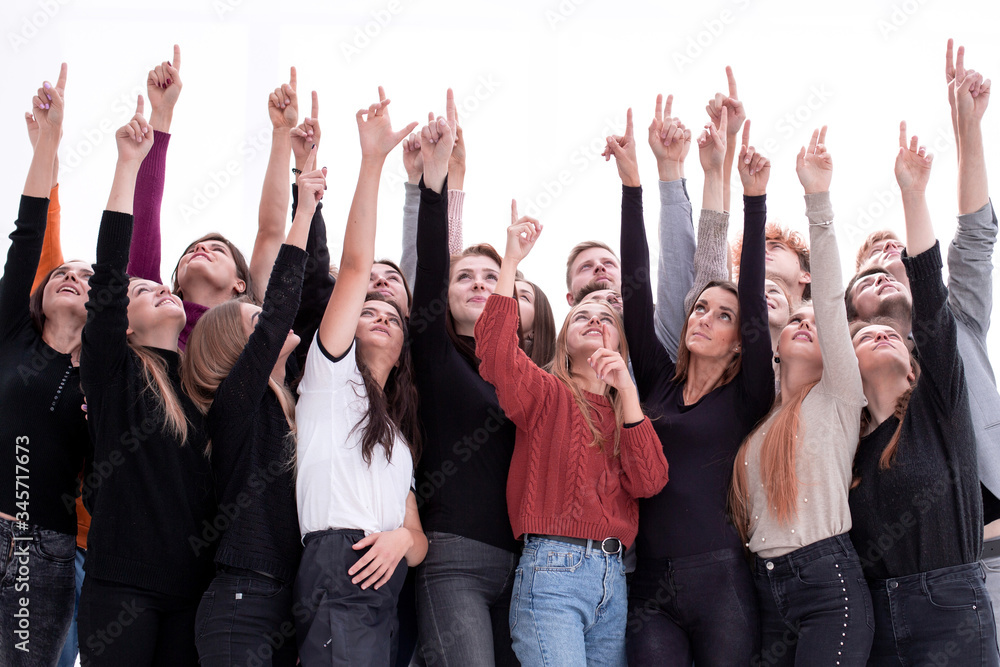 group of diverse young people pointing up group of diverse young people pointing up