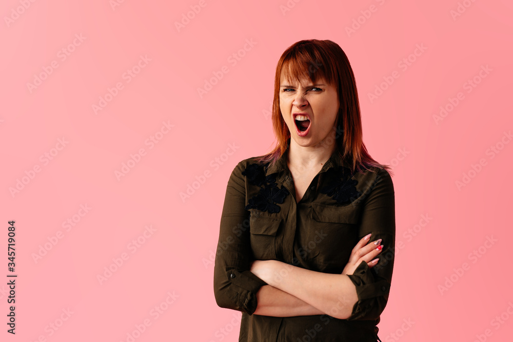 Image of screaming agressive young woman standing screaming isolated shoot Image of screaming agressive young woman standing screaming isolated shoot