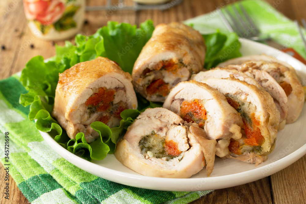 Festive appetizer. Chicken meatloaf with dried apricots, mozzarella and herbs on a festive table. Festive appetizer. Chicken meatloaf with dried apricots, mozzarella and herbs on a festive table.