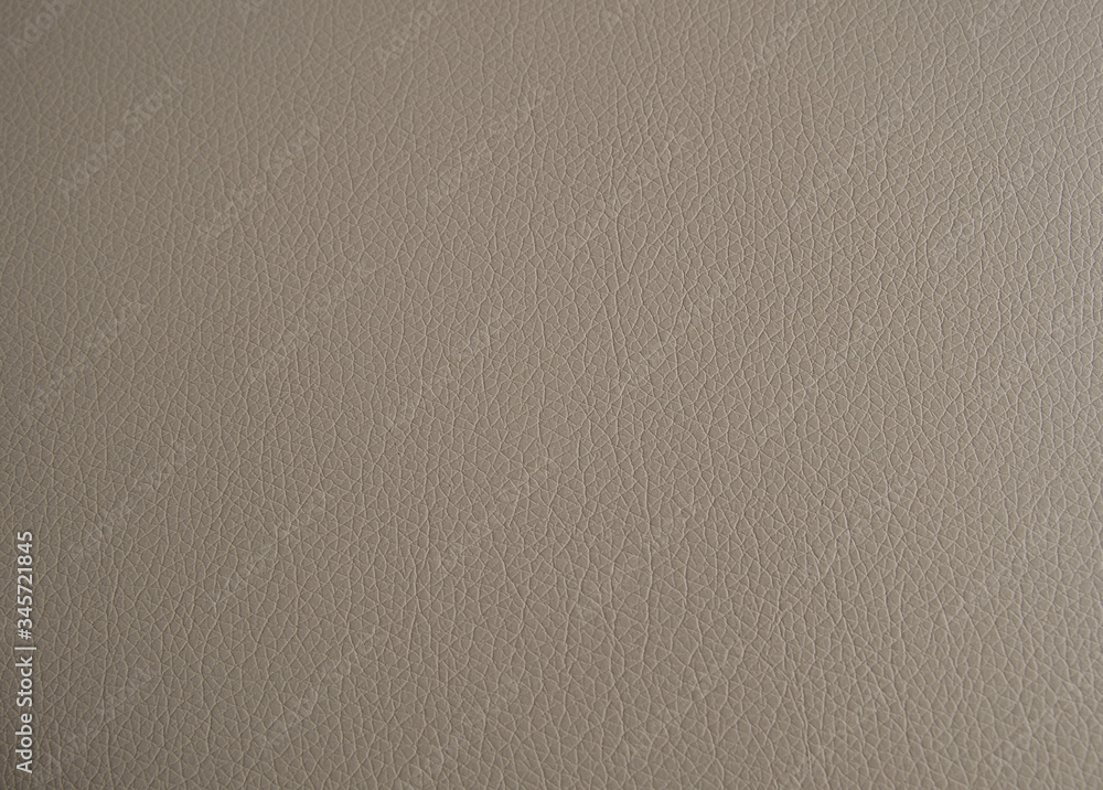 The texture of genuine leather is a light beige tone. Background backdrop textured effect for design. Faux eco leather piece of faux leather The texture of genuine leather is a light beige tone. Background backdrop textured effect for design. Faux eco leather piece of faux leather