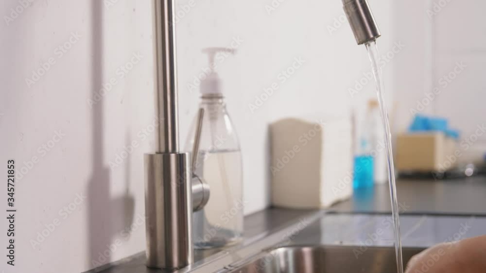 hygiene, health care and safety concept - doctor or nurse washing hands with liquid soap at hospital hygiene, health care and safety concept - doctor or nurse washing hands with liquid soap at hospital