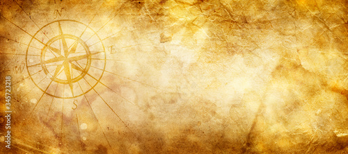 Old compass on paper background © merydolla