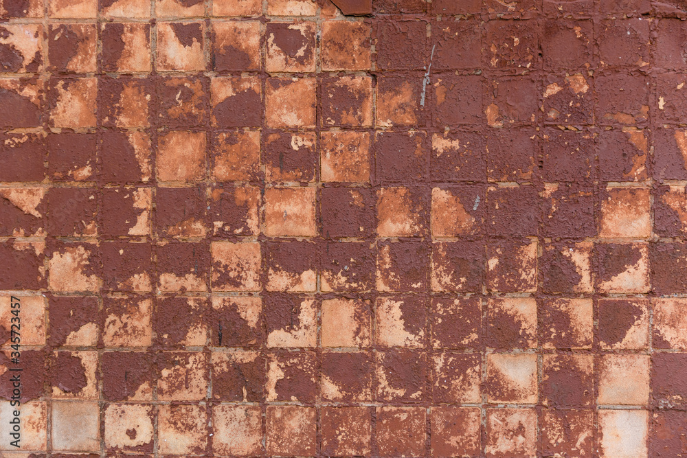 Fototapeta premium Abstract background old cracked square ceramic tile. Great background or texture.