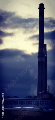 Factory chimney at dusk