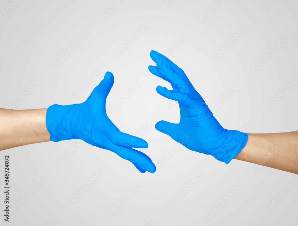 Hands in medic's nitrille blue glove.
Hands in medic's nitrille blue glove.