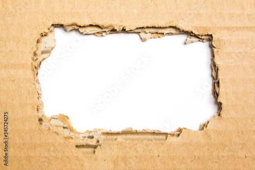 Brown torn corrugated cardboard on white background. Copy space for advertising text message.